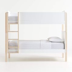 there is a bunk bed with a ladder on the bottom and a pillow on top