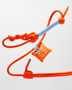 an orange cord with a white tag attached to it that says banana punch on the end