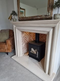 a fireplace with a mirror above it in a living room