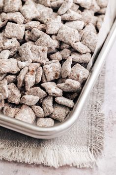 a metal pan filled with dog food on top of a table