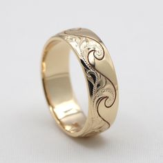 a wedding ring with an intricate design on it