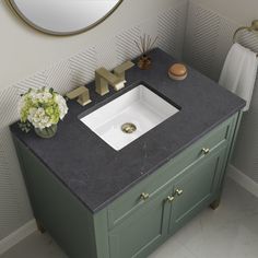 a bathroom with a sink and mirror in it