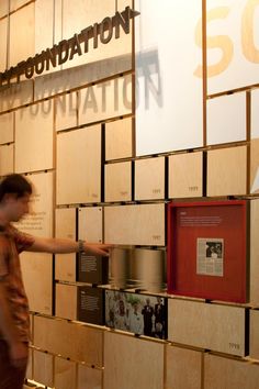 a man pointing at some type of item on display