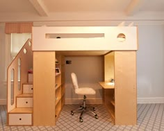 there is a loft bed with stairs to the top and desk below it in this room