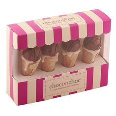 four chocolate covered cupcakes in a pink and white striped box with the word choconchoc on it