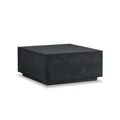 a black square table sitting on top of a white floor