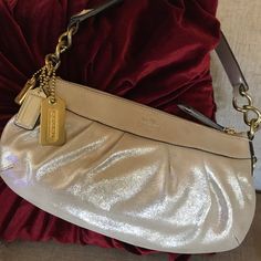 I Purchased This New From The Coach Boutique Store. Shimmery Beige Leather ( Looks Light Gold Or Champagne Because Of The Beautiful Shimmer) With Gold Hardware. In Giftable Condition. However Tags Are Inside The Bag And Not Attached Anymore. Light Purple Interior. Unused. Well Kept. Comes With Dust Bag And 3 Coach Bag Charms In The Photo. I Consider It Rare. I Communicate Within Poshmark Only. This Is A Final Sale. I Do Not Accept Returns. Coach Leather Party Bags, Chic Coach Party Bag, Chic Party Bags By Coach, Evening Bags With Silver-tone Hardware In Purple, Purple Evening Bags With Silver-tone Hardware, Coach Purple Shoulder Bag For Evening, Coach Purple Evening Bag, Chic Purple Bag With Silver-tone Hardware, Elegant Coach Shoulder Bag For Party