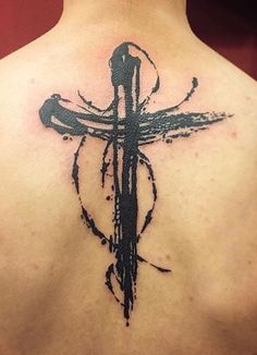 a man with a cross tattoo on his back