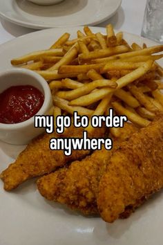 fried chicken and french fries on a plate with ketchup