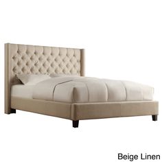 a white bed with a beige headboard and foot board