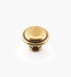 an antique brass door knob on a white background