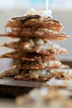 a stack of cookies sitting on top of a wooden table