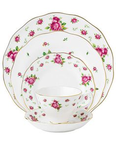 a white and pink rose china dinner set