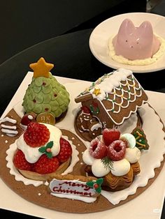 there are some cookies and pastries on the plate with icing, strawberries