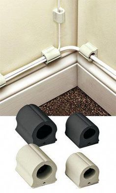 the corner of a wall with three different pieces of pipe and fittings attached to it