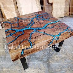 a wooden table with blue paint on it