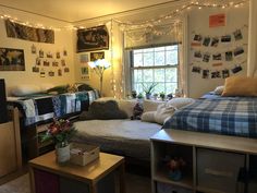 a bedroom with a bed, desk and television