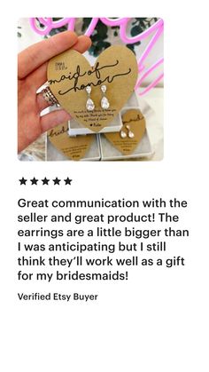 someone is holding up some paper hearts with the words great communication with the seller and great product