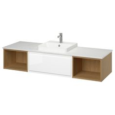 a white sink sitting on top of a wooden cabinet