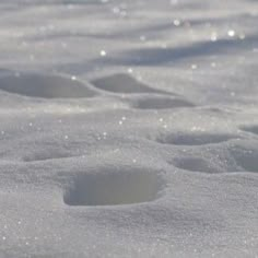 the snow is white and has small holes in it that look like they are melting