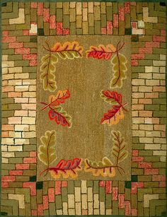 an area rug with leaves and bricks on it