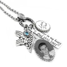 a personalized necklace with an angel charm and a photo on the front is shown