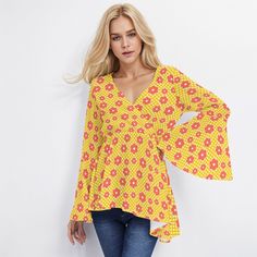 * Introducing our 70s Style Top, a vintage-inspired blouse for women that exudes boho and hippie vibes. * Made from 100% polyester, this boho top features large bell sleeves and a wrap top bodice. * With its high empire waistline and loose-fitting lower bodice, it ensures both style and comfort. * Adorned with a super cute yellow gingham print with pink floral pattern print, it's perfect for adding a retro touch to your wardrobe. Designed in California by Trendy Hip Buys. Hand Sewn Overseas 100% Polyester I designed this for those who loves the boho, 70s hippie blouse style! In cute retro floral pattern print with yellow gingham background. V neckline with wrap style top bodice. Long bell sleeves. Please see measurements in the photo listed. Pair it with your bell bottom jeans, chunky heel Hippie V-neck Blouse For Fall, Retro V-neck Summer Blouse, Spring Hippie Tops With Boho Print, Spring Hippie Top With Boho Print, Hippie Floral Print Blouse For Spring, Vintage Boho Print V-neck Top, Vintage Print Long Sleeve Summer Blouse, Hippie Style V-neck Printed Blouse, Vintage Print Long Sleeve Blouse For Summer