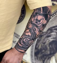 a man with a tattoo on his arm