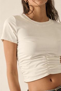 This cute crop top puts a fun twist on a classic style with its white ruched short sleeves. Perfect for adding some playful charm to your outfit, while keeping you cool and comfortable. Gotta love that ruching! Crew Neck Short Sleeves Ruched Detail Cropped Womens Crop Tops, Cute Crop Top, Short Sleeve Crop Top, Ruched Bodice, Cute Crop Tops, Short Sleeve Cropped Top, Fitted Silhouette, Knitted Tshirt, White Crop Top