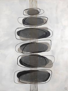 a group of black plates sitting on top of a white table next to each other