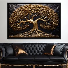 a living room with black couches and a gold tree painting on the wall above it