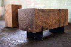 two pieces of wood sitting on top of a wooden floor