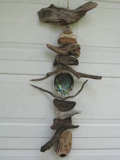 a sculpture made out of driftwood on the side of a building