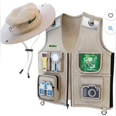 a hat, camera, and other items are arranged in a vest that is attached to a wall