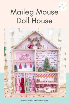 a doll house with christmas decorations on it and the words, malleg mouse doll house