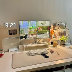 a desk with a computer monitor and keyboard on it