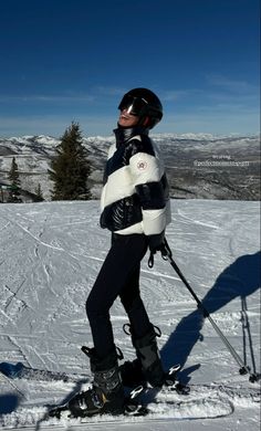 a person standing on skis in the snow