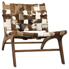 a brown and white chair sitting on top of a wooden frame