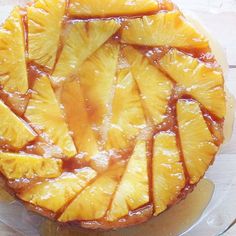 a pineapple upside down cake on a glass plate