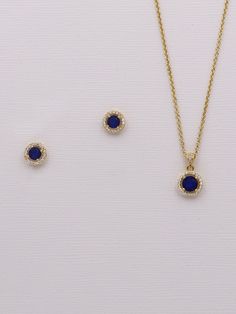 "This dainty jewelry set will surely add sparkle on your special day! Boasting brilliant cubic zirconia in a framed round, classic design with a navy blue sapphire colored cz center stone set in brilliant gold plating. Stud earrings measure 8mm. Necklace measures 16\" and has an extender to extend up to 18\" long. This beautiful jewelry comes in a gift box ready for gift giving! Choose from multiple jewelry options. Matching (optional) bracelet measures 7\" and finishes out the look. This set is Dainty Blue Cubic Zirconia Jewelry, Blue Cubic Zirconia Fine Jewelry Sets, Blue Jewelry Sets With Sparkling Stones For Anniversary, Blue Diamond Jewelry Sets For Gifts, Blue Diamond Jewelry Set As Gift, Blue Diamond Jewelry Sets, Royal Blue Cubic Zirconia Jewelry Gift, Royal Blue Jewelry With Brilliant Cut As Gift, Royal Blue Brilliant Cut Jewelry Gift