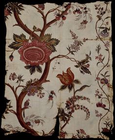 an embroidered cloth with flowers and birds on it, in the shape of a tree