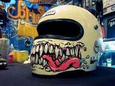 the helmet is decorated with an image of a monster's mouth