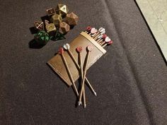 some dice and wooden sticks are laying on the floor