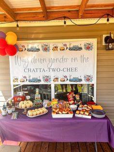 a purple table topped with lots of food