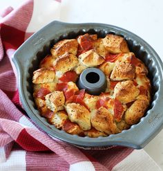 a bundt cake sitting on top of a red and white checkered table cloth