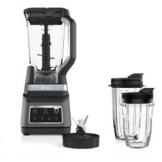 two blenders sitting next to each other on a white surface