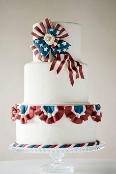 a white cake with red, white and blue decorations