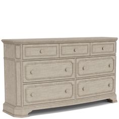 a large white dresser with drawers and knobs on the bottom drawer, against a white background