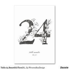 a black and white photo of the number twenty two with flowers on it, in front of