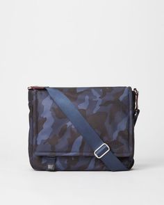 the camo messenger bag is blue and has a strap that goes down to it